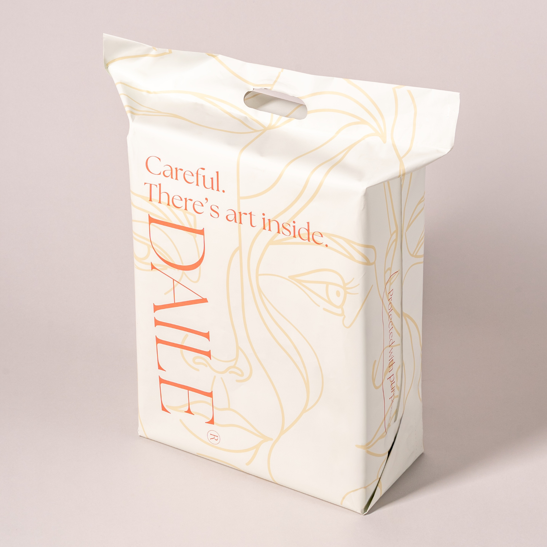 Elegant art puzzle packaging with minimalist face line art, handle, and 'Careful. There’s art inside.' text.