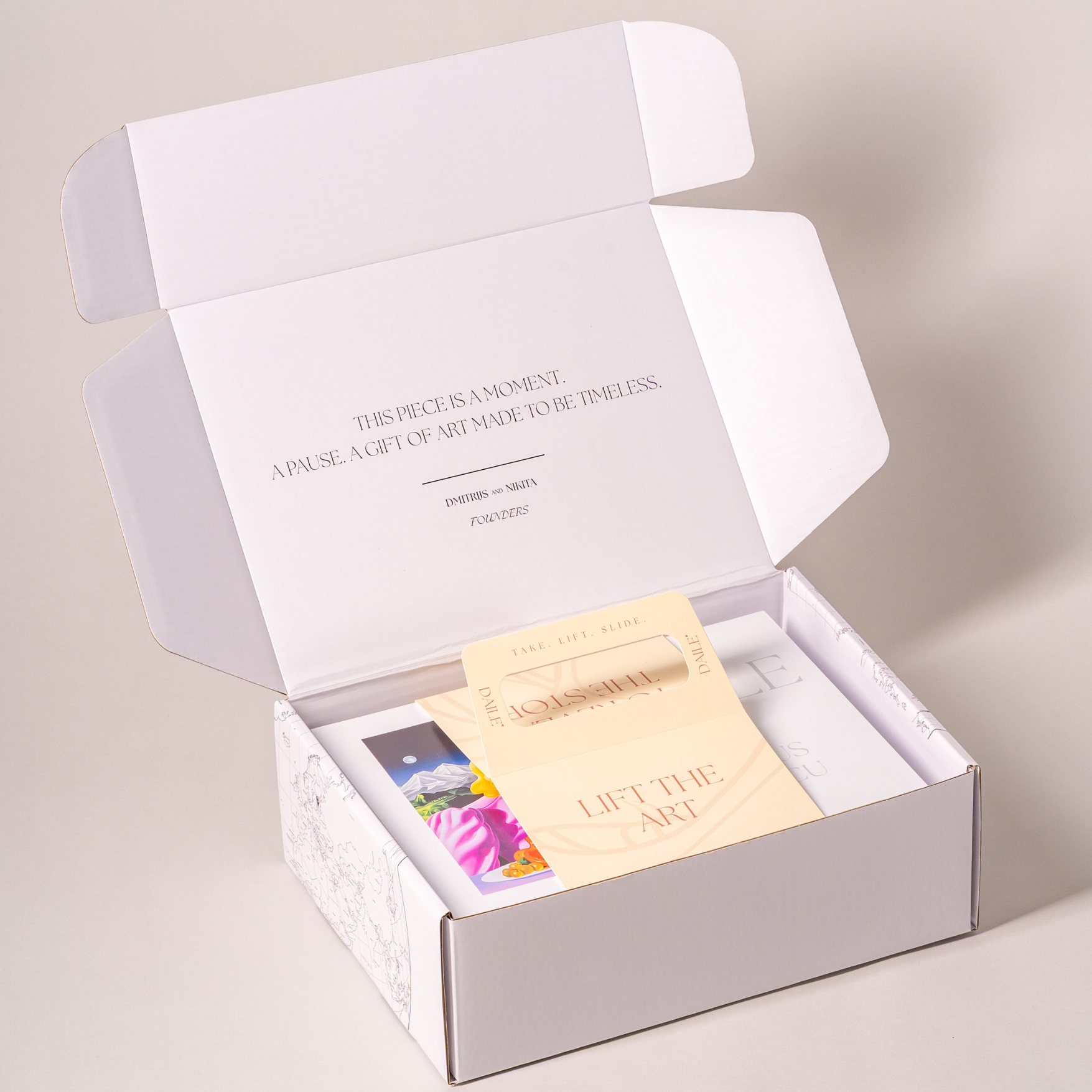 Open art puzzle box with collectible puzzle, insert cards, and inspirational packaging