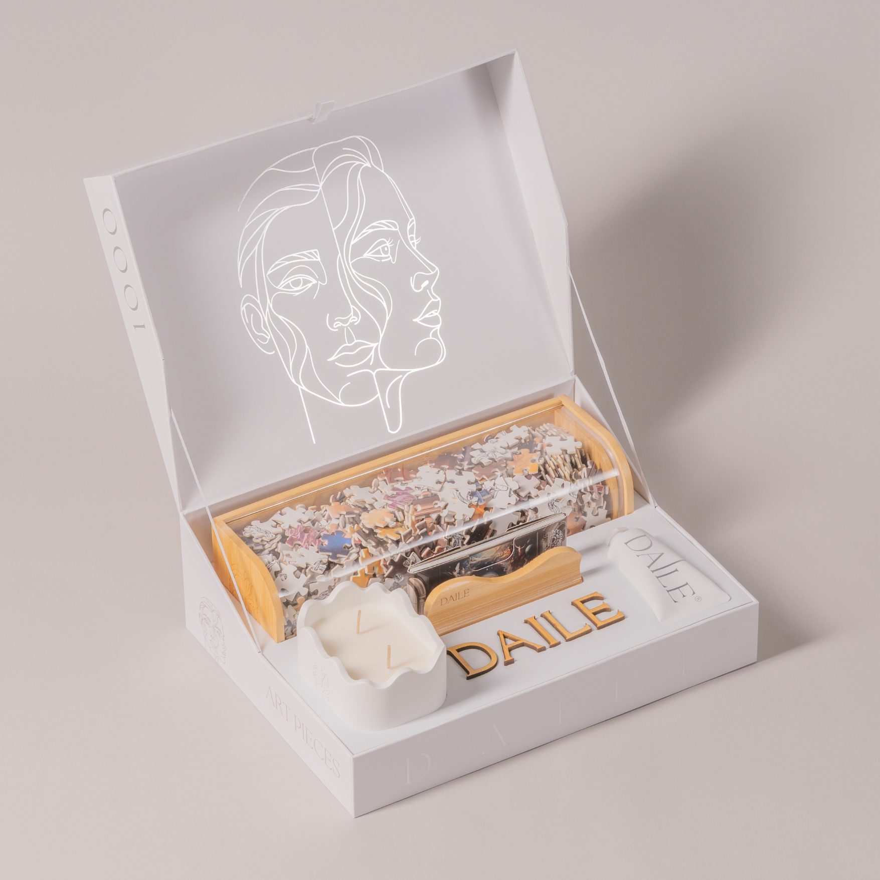 Premium art puzzle gift set with abstract face box design and puzzle pieces display.