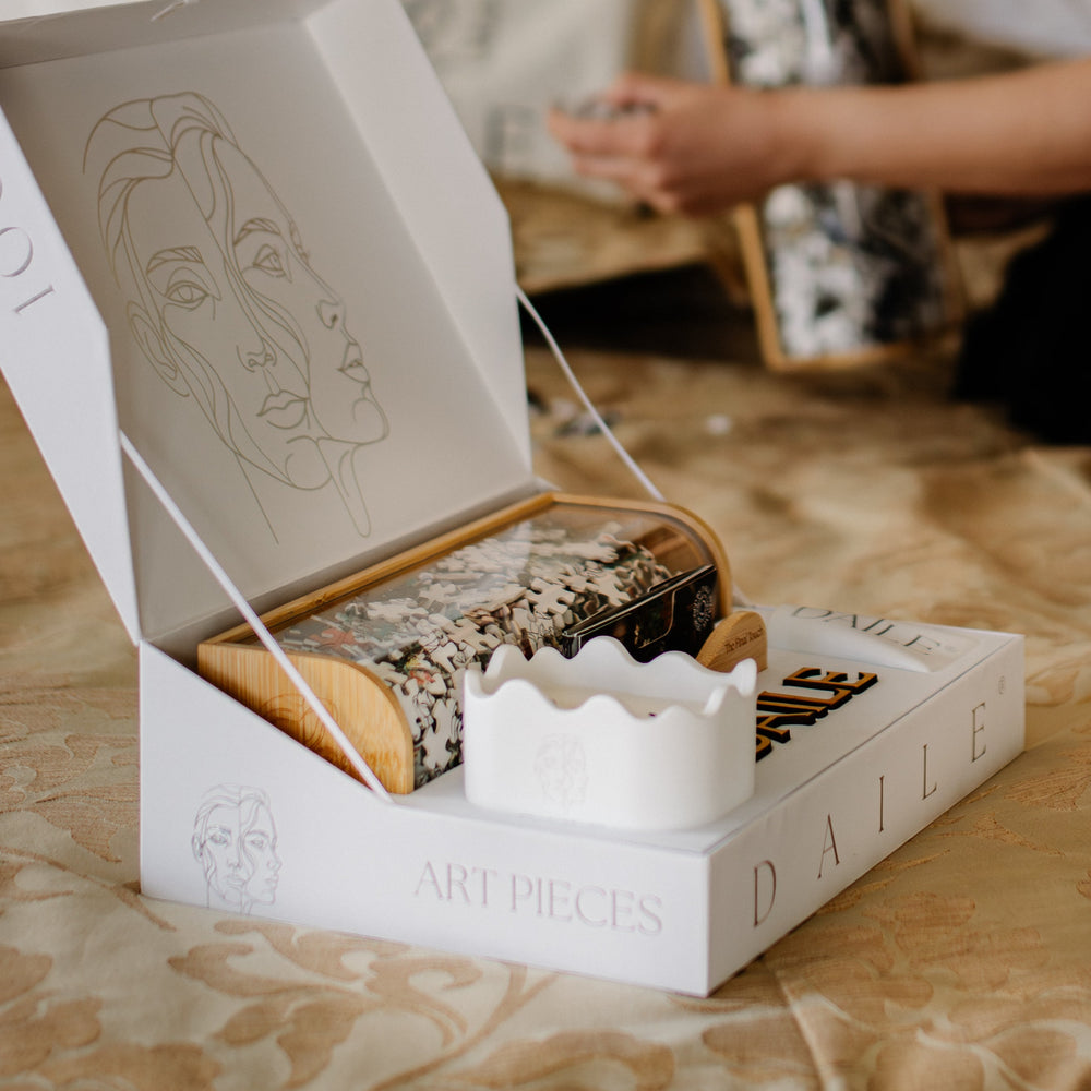 A curated art gift set, detailed from first opening to final display.